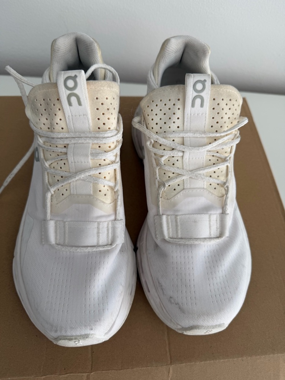 On Running White and Cream Athletic Sneakers